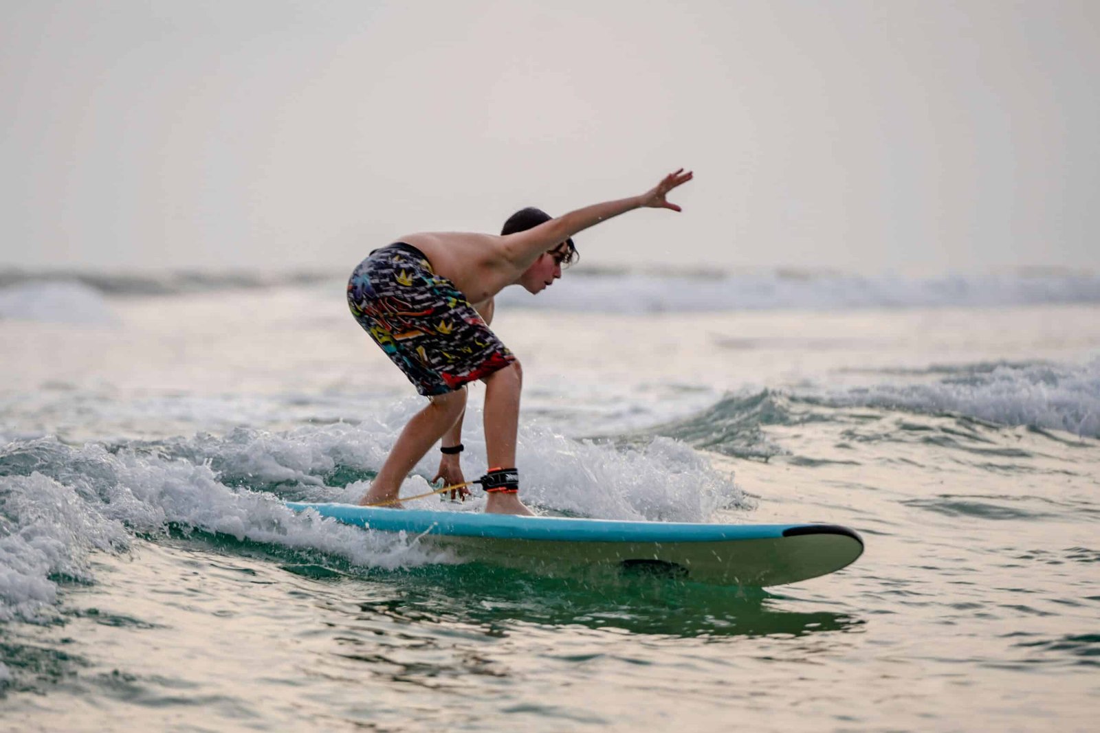 boy surfing in waligama during his sri lanka Holiday tour 2024 with our travel companies list